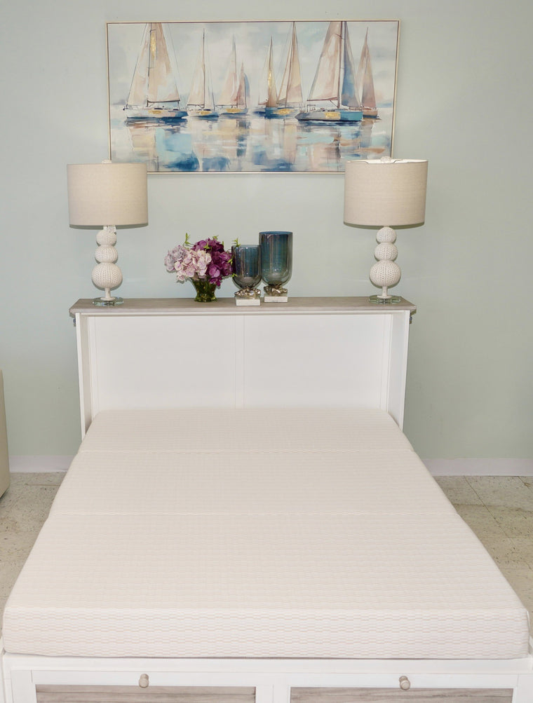 A cabinet bed open as a guest bed, showing the dedicated mattress on its fold-out platform
